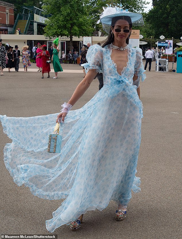 Another woman donned a shimmery, breezy sheer dress that featured a plunging neckline.