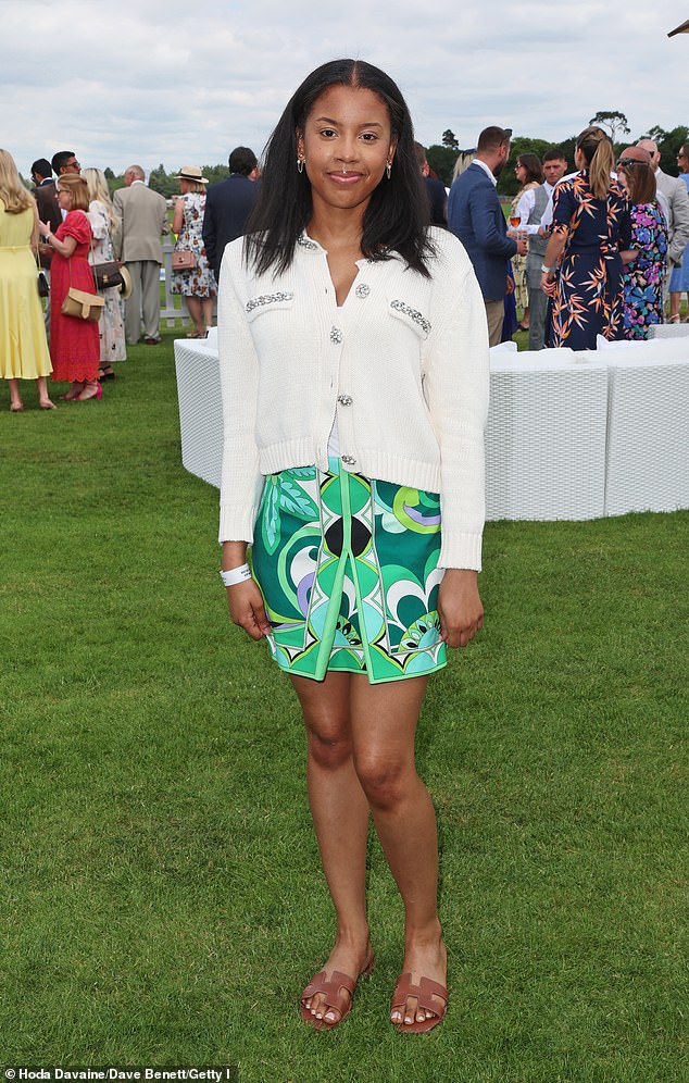 Kasia Coles lesforis wore a vibrant green printed skirt which she paired with a white cardigan