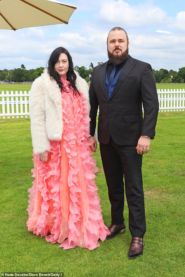 Brigitte Othala von Habsburg turned heads in a bright pink dress and cream fur coat, while Ingo Othala donned a sleek black suit.