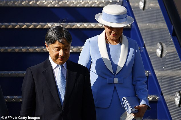 Empress Masako, 60, looked elegant in a light blue suit with white lapels and a matching hat.