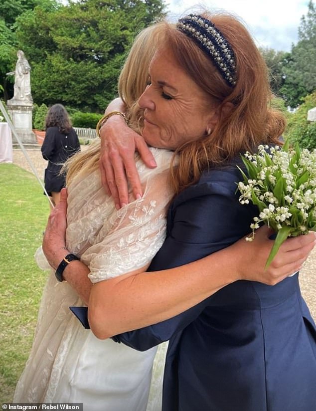 Pictured: The Duchess of York is seen hugging bride Marissa Montgomery at their Chelsea Physic Garden wedding this weekend.