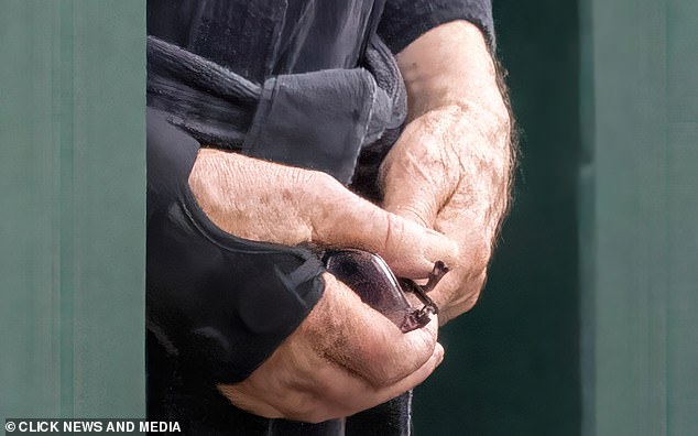 Yesterday Sir Ian McKellen is seen wearing a wristband and holding his glasses in his hand.