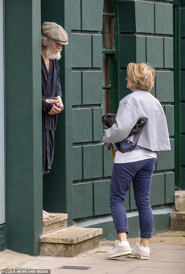 The friend arrives at Sir Ian McKellen's home in London yesterday after his accident