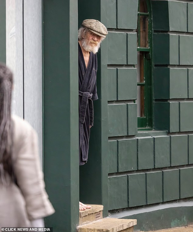 Sir Ian McKellen looks on from his home in London yesterday, almost a week after his accident.