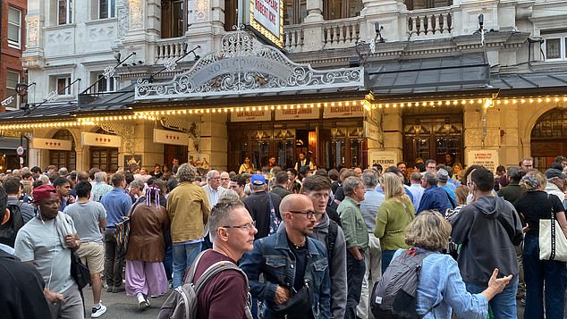 Audience members gather outside the Noel Coward Theatre in London after the fall