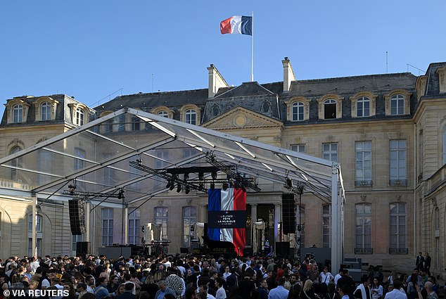 Attendees gather next to the stage during the annual conference. "music festival" One-day music festival in the courtyard of the Elysee presidential palace in Paris, France, on June 21, 2024.