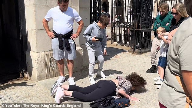 The woman fell to the ground and fell face down as her purse flew beneath her. Concerned onlookers rushed to her aid and helped her to her feet.