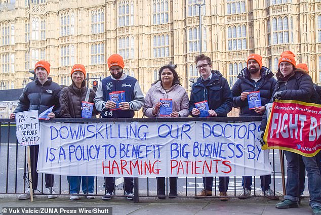 Protesters, including doctors, gathered outside Parliament to protest against the handover to Physician Associates on February 26, 2024. Pictured is Dr. Robert Laurenson (third left), co-chair of the Young Doctors Committee of the BMA, participating in the protest.