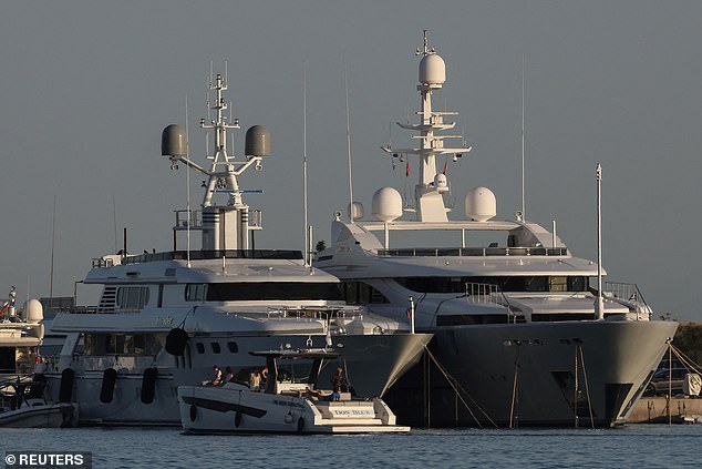 A view of a yacht (R) whose crew members allegedly started a forest fire with fireworks launched from the ship on the island of Hydra, at a marina in the southern suburb of Athens, Greece, June 23, 2024.