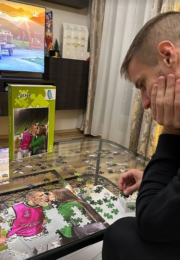 Varga is seen completing a puzzle of him celebrating with Laura.