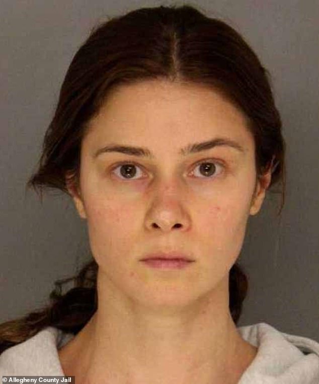 Virzi, 29, seen in her booking photo, was babysitting the boy while his parents were at UPMC Children's Hospital in Pittsburgh with his twin after Virzi said she saw an injury in his groin.