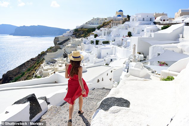 Savvy Australians can get up to 59 days off in 2023 by using just 20 days of annual leave, booking work weeks around public holidays (pictured, woman in Santorini on holiday)