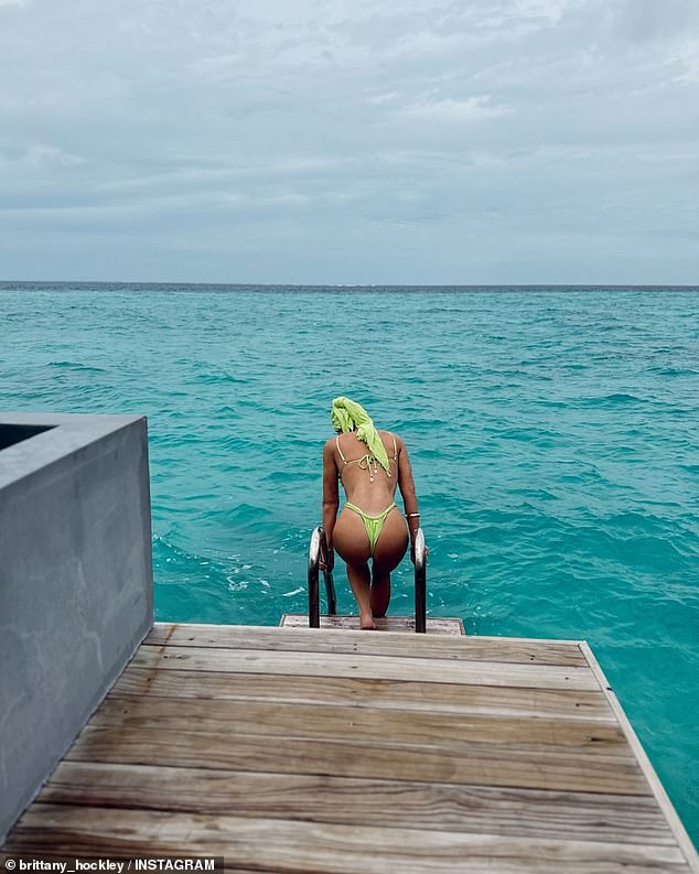 In one racy photo, Brittany put on a very racy display in a green thong bikini.