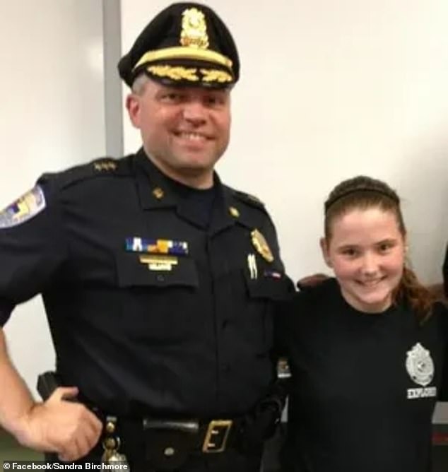 Sandra Birchmore joined the Stoughton Police Department's Explorer Program at the age of 13. She is pictured with former officer Robert Devine.