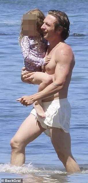 Jeremy was seen on the beach with his daughter, to whom Dakota is godmother.