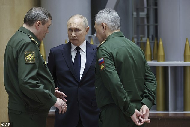 The International Criminal Court has issued arrest warrants for Russia's Chief of the General Staff Valery Gerasimov and former Defense Minister Sergei Shoigu (pictured with Vladimir Putin).