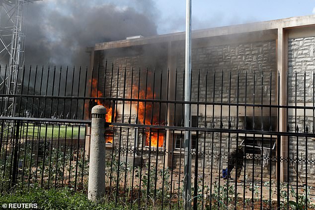 Flames rise from a parliament building on the day of a demonstration against Kenya's proposed finance bill in Nairobi, Kenya, June 25.