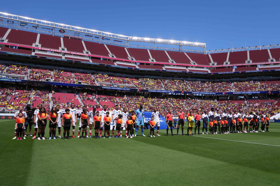 June 22, 2024; Santa Clara, California, USA; Players from Venezuela and Ecuador meet on the field before the match at Levi's Stadium. Mandatory Credit: Darren Yamashita-USA TODAY Sports