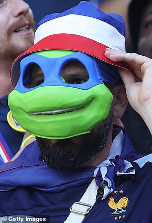 A fan in the stands put on a Ninja Turtles mask.