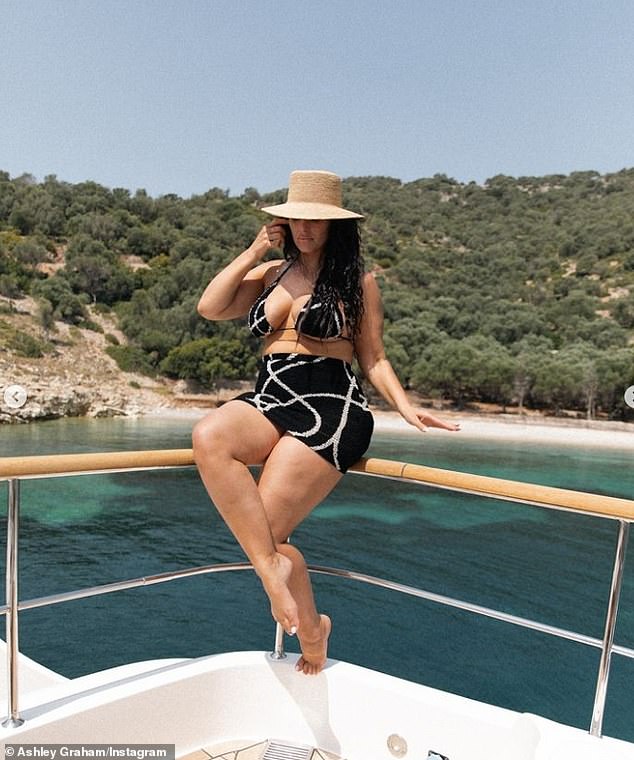 The Vogue model was seen wearing a black and white string bikini top that did double duty of showing off her underboob and cleavage. She added a matching miniskirt in the exact same pattern as she posed on a yacht in Corfu, Greece.