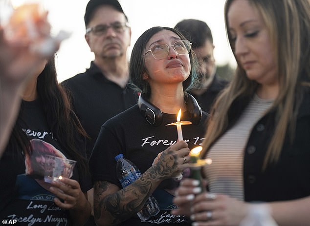 Alexis Nungaray, Jocelyn's mother held a candle during a vigil for her daughter Friday night.