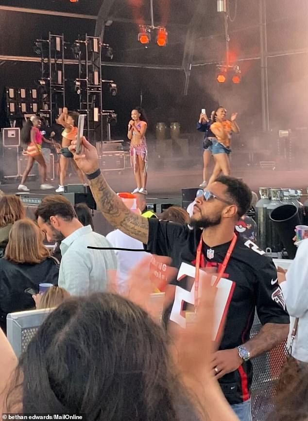 Andre, who was watching from the front, was joined by his mother, Deborah Thornhill, who looked incredibly proud of the singer as they filmed the crowd singing her songs.