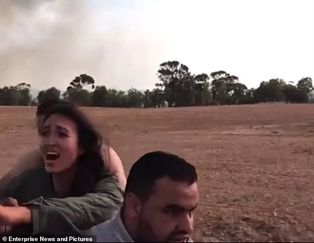 This photo of Noa, with her arms outstretched towards her boyfriend as she screams for help, became one of the most recognizable images of the atrocities after it was published by The Mail on Sunday, October 8.