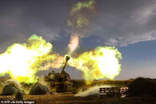 An Israeli artillery unit fires during a military drill near the Lebanese border on November 2, 2023.