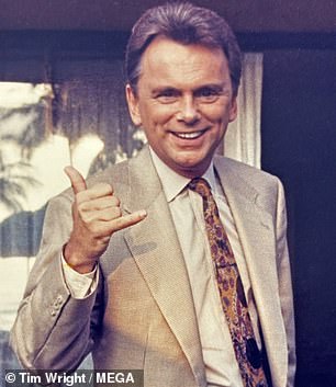 Retired Wheel of Fortune host Pat Sajak showing off a shaka