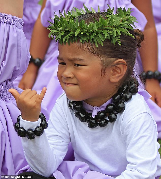 The symbol has long been known to connect people around the world with their strong island roots. It is also shown as a symbol of belonging and community. (pictured: a boy holding a shaka)