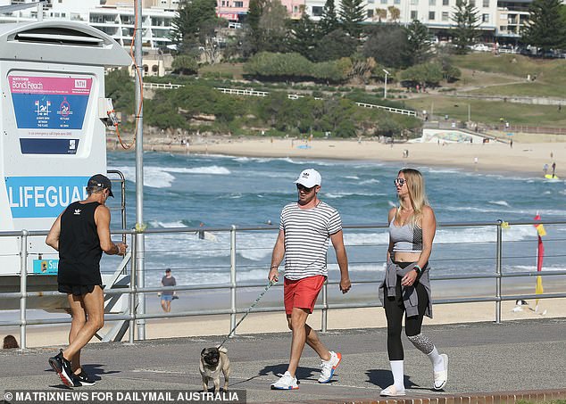 Further north in Brisbane, conditions will be much warmer, with highs of 24°C on Wednesday, 22°C on Thursday and 23°C on Friday (pictured, people enjoying the sunshine in Sydney).