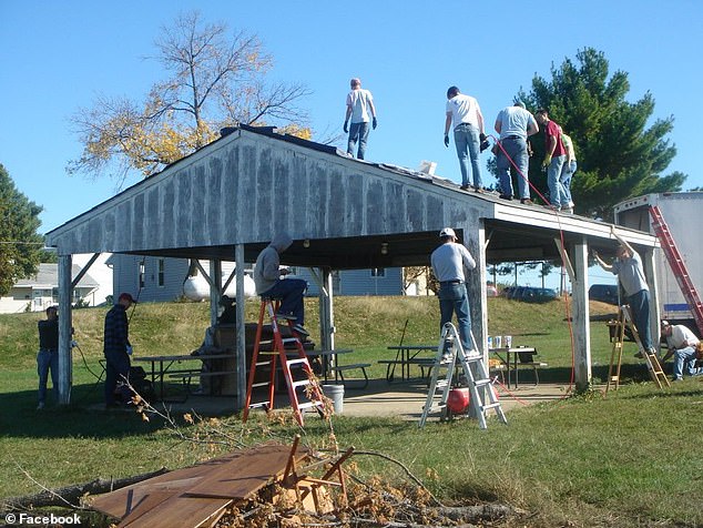 Neighbors build a structure as part of their professional training