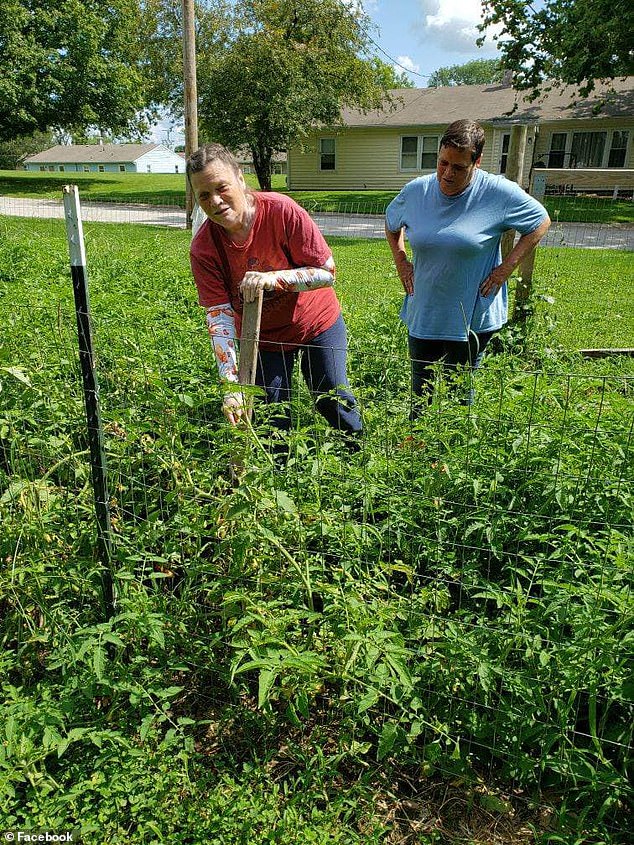 Disabled residents work in a garden within the small neighborhood