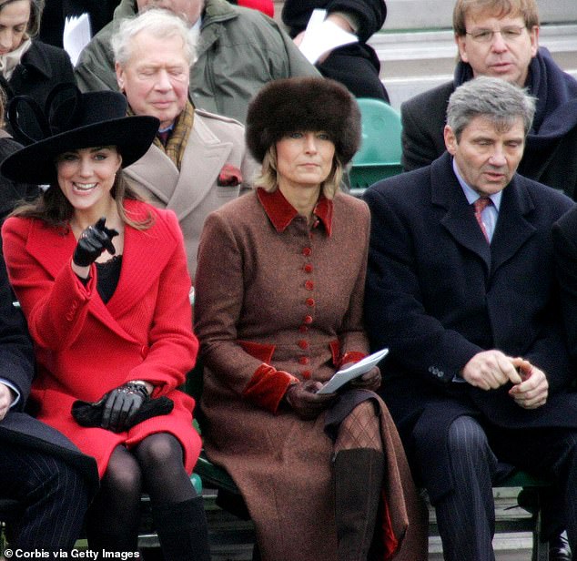 In December 2006, Kate joined Queen Elizabeth II, Prince Philip and then-Prince Charles at William's passing out parade at Sandhurst. It was her first official appearance with the Royal Family. Above: Kate sitting with her mother Carole and her father Michael and William's friends.