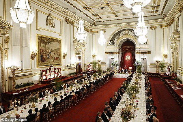 Guests are seated during the state banquet at Buckingham Palace in London yesterday.