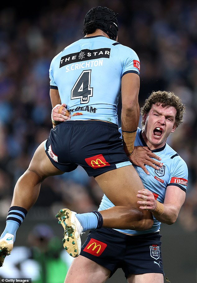 Liam Martin of the Blues (right) celebrates with Stephen Crichton after scoring the first try in the second game at the MCG.