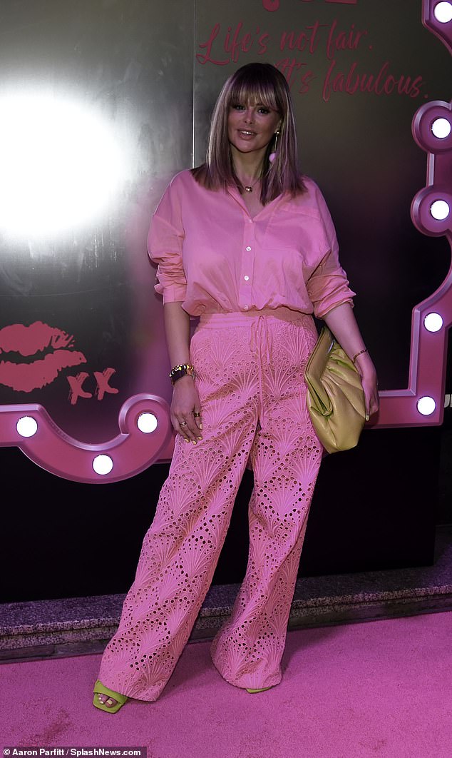 Rhian looked glamorous in a fuchsia poplin shirt which she tucked into her matching embroidered trousers, adding lime heels that matched her bold pedicure.