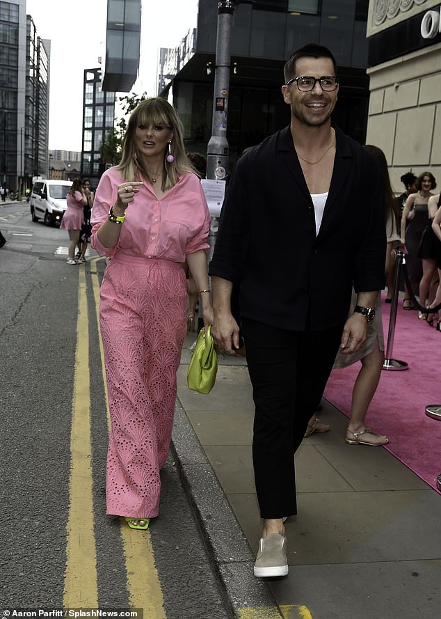 Coronation Street star Oliver, 43, sported a stylish look in a black kimono with matching trousers and a white t-shirt underneath.