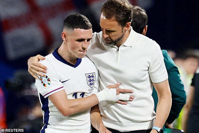 Foden and Gareth Southgate chat after the final whistle in Cologne on Tuesday