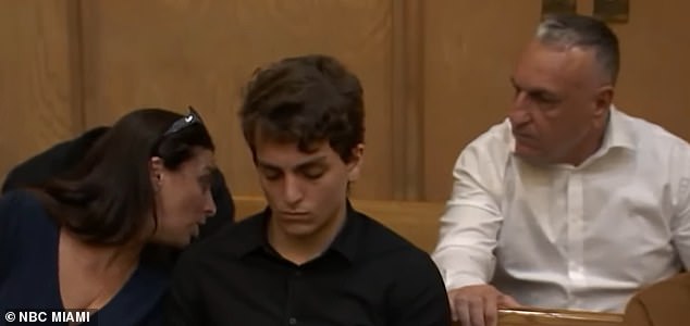 He is seen with his parents in court. His father is Eli Gil, who works at the Israeli embassy.