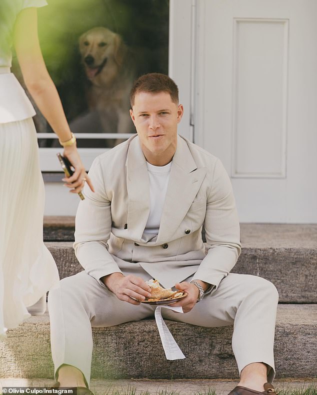 He was also seen enjoying a sandwich while his new wife was on the left.