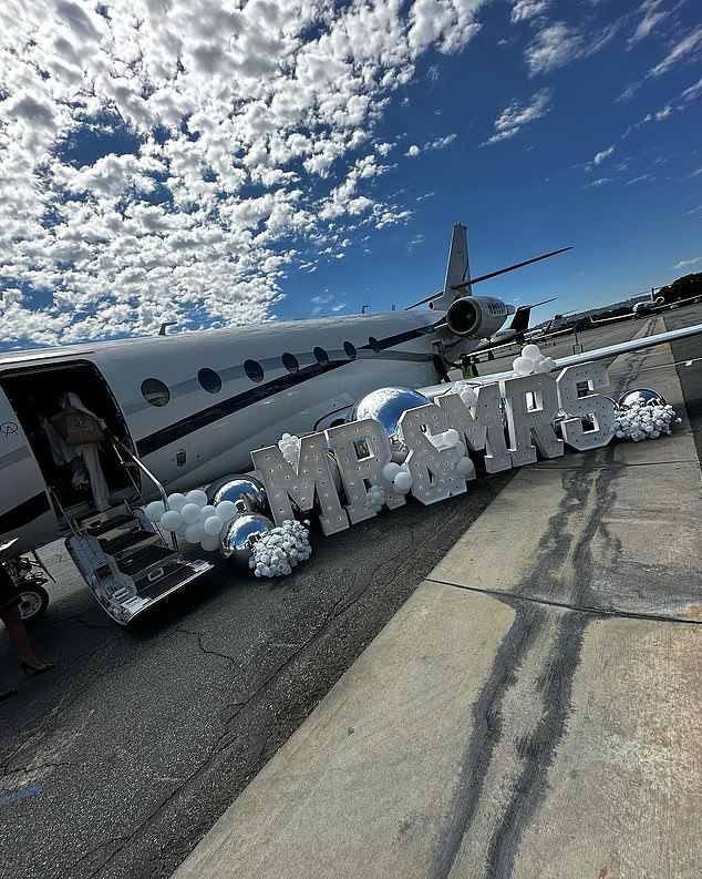 Outside the plane was a sign that said Mr. and Mrs.