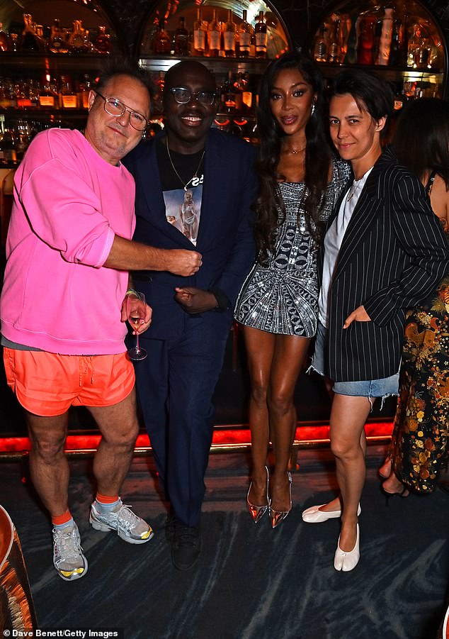 The man in question is renowned German fashion photographer Juergen Teller (left), who recently attended Naomi Campbell's A Midsummer Night at NYX Mayfair in London wearing the same outfit. Pictured with (LR Edward Enninful, Naomi Campbell and Dovile Drizyte)