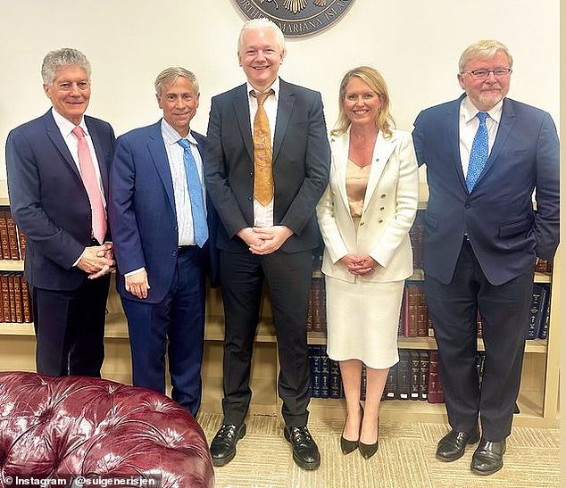 Assange appears in the center with Stephen Smith (left), American lawyer Barry Pollack (second from left), lawyer Jen Robinson (second from right) and Kevin Rudd (far right).