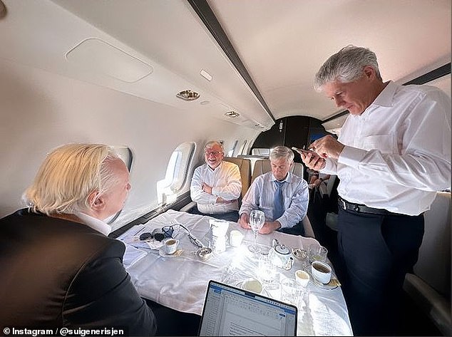 Assange on a private plane to Australia with Kevin Rudd (centre, left) and former Labor Minister Stephen Smith (right)