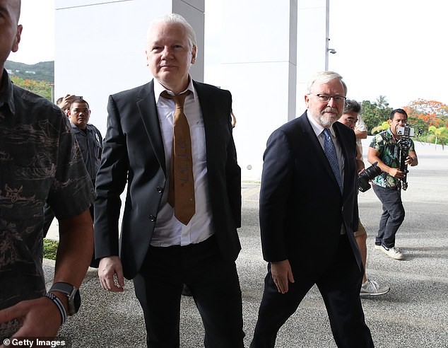 Former prime minister and now US ambassador Kevin Rudd (right) and Julian Assange (left) catch the eye.