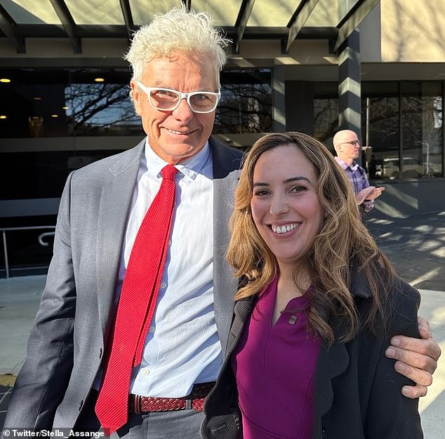 Stella Assange poses for a photograph of army whistleblower David McBride (above, together)