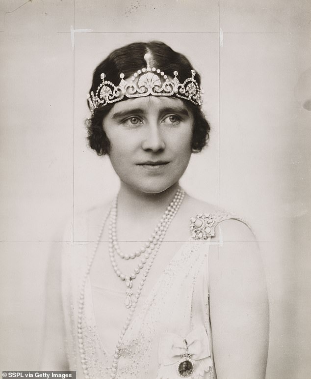 The delicate diamond tiara has fan motifs topped by floating diamond arches and is also known as the Papyrus Tiara; It was created by the British jeweler Garrard from one of the Duchess Elizabeth of York's own necklaces. Photographed in 1923.