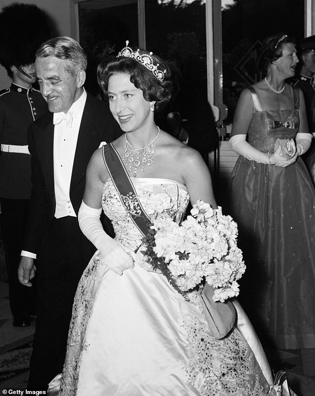 Princess Margaret was known to be a big fan of the tiara. In the photo wearing it in 1959, in Portugal.