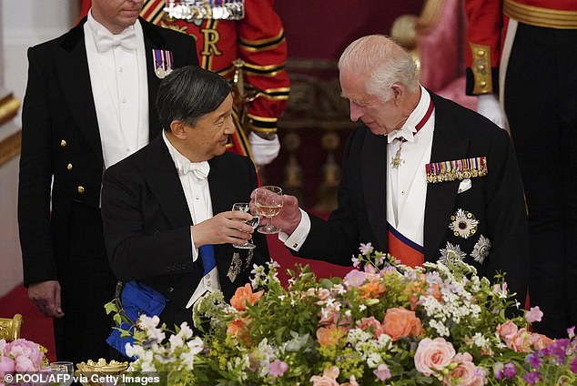 Applause: The two heads of state clink their glasses after reflecting on their nations' close relationship.